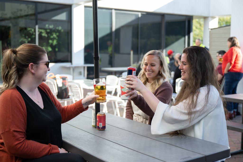 employees cheersing beverages