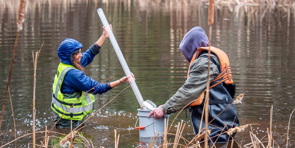 jones river watershed association volunteers check sediment levels in the river